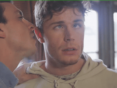 Man Whispering Into Another Man's Ear GIF