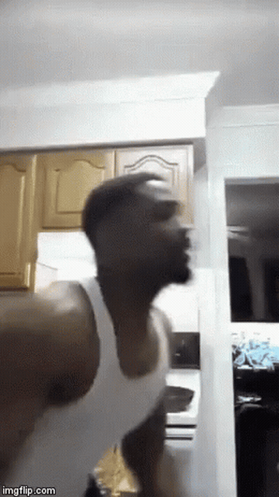 Man White Tank Top Standing Head Down Kitchen GIF