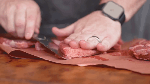 Man With Apple Watch Cutting Meat GIF