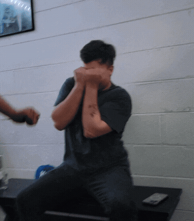 Man With Arm Tattoo Covering Face GIF