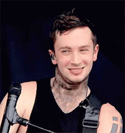 Man With Arm Tattoo Holding Microphone GIF