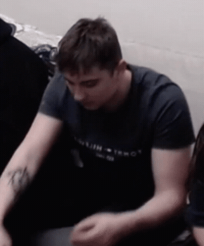 Man With Arm Tattoo In Black Tommy T-Shirt GIF
