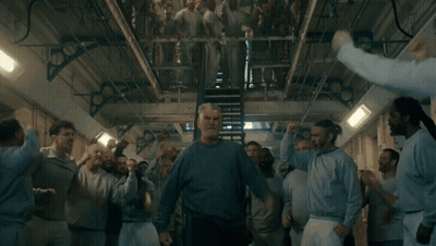 Man With Arm Tattoo Sitting At Computer Desk GIF