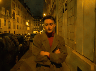Man With Arms Crossed At Night Building GIF