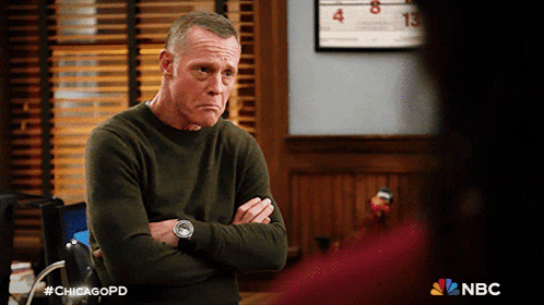 Man With Arms Crossed In Front Of Calendar Saying Chicagopd GIF