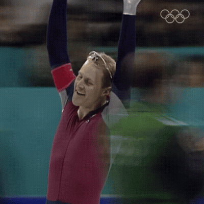 Man With Arms In Air In Red And Blue Outfit GIF