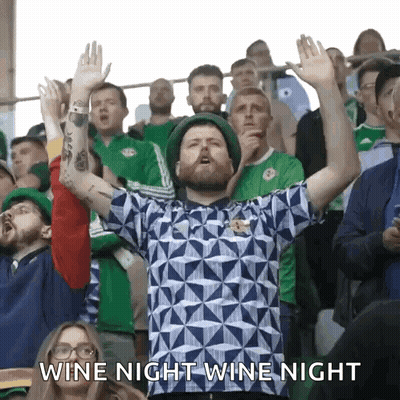 Man With Arms In Air Says Wine Night GIF