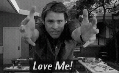 Man With Arms Outstretched And Love Me Sign GIF