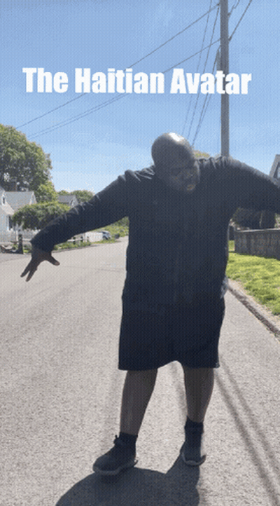 Man With Arms Outstretched On Roadside Caption The Haitian Avatar GIF