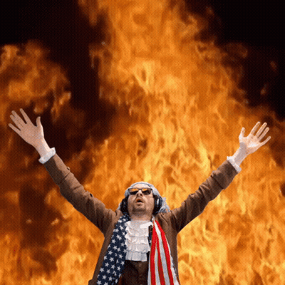 Man With Arms Outstretched Wearing American Flag GIF
