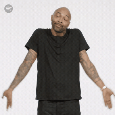 Man With Arms Outstretched Wearing Spotify Logo GIF