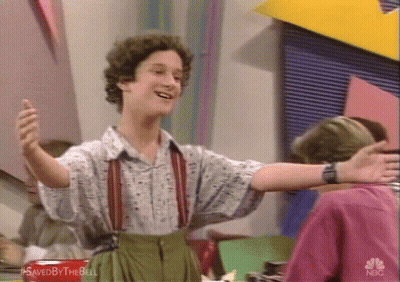 Man With Arms Outstretched Wearing Suspenders GIF