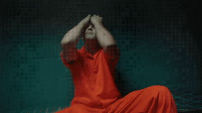 Man With Arrow Tattoo Covering Face GIF