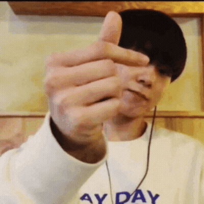 Man With Ay Day Sweater Thumbs Up GIF