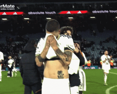 Man With Back Tattoo Lifted By Another Man GIF