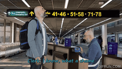 Man With Backpack In Front Of Emergency Exit GIF