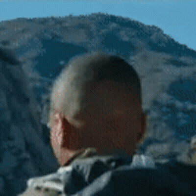 Man With Backpack In Front Of Mountain GIF