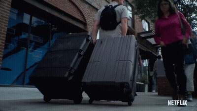 Man With Backpack Looking At Camera With Netflix Logo GIF