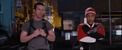 Man With Backpack Next To Man In Red And White Sweatshirt GIF