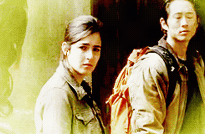 Man With Backpack Next To Woman GIF