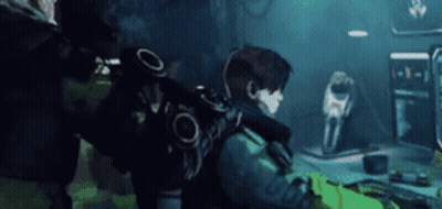 Man With Backpack Playing Video Game GIF
