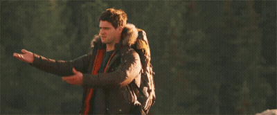Man With Backpack Standing In Forest GIF