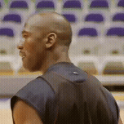 Man With Backpack Standing In Front Of Empty Seats GIF