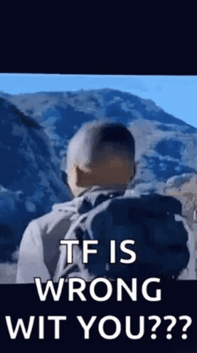 Man With Backpack Standing In Front Of Mountain GIF