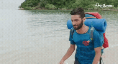 Man With Backpack Walking On Beach Eitb.eus GIF