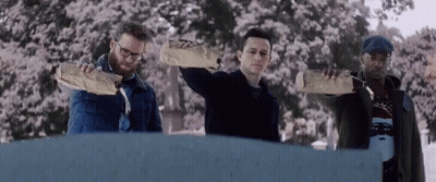 Man With Backpack Walking Past Home Sign In Hallway GIF