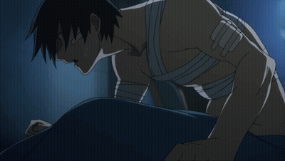 Man With Bandage On Arm Laying On Floor GIF