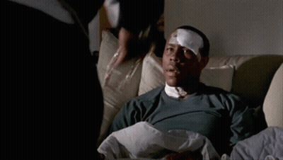 Man With Bandage On Eye Laying In Chair GIF