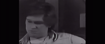 Man With Bandage On Eye Standing Next To Another Man GIF