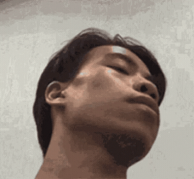 Man With Bandage on Forehead Looking at Camera