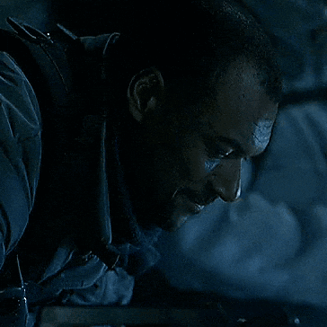 Man With Bandage On Forehead Looking Down GIF