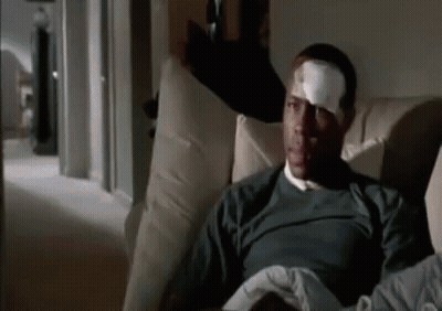 Man With Bandage On Forehead Sitting On Couch GIF