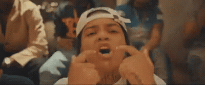 Man With Bandage On Head Making Funny Face Holding Fingers To Face GIF