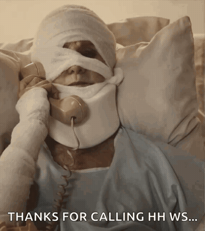 Man With Bandage On Head Talking On Phone GIF