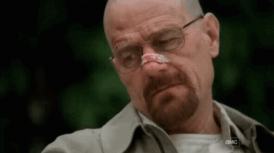 Man With Bandage On Nose And Glasses Looking Down GIF