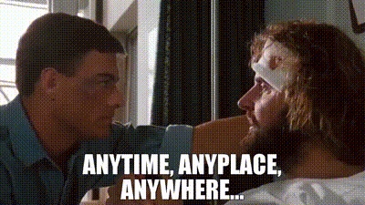 Man With Bandaged Head Talking To Another Man GIF