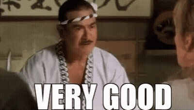 Man With Bandana And Headband Talking To Woman GIF