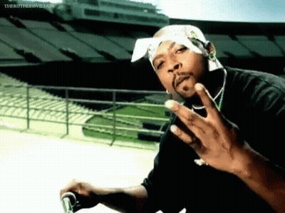 Man With Bandana Giving Middle Finger In Front Of Stadium GIF