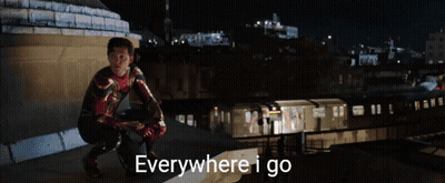 Man With Bandana Holding Another Man's Arm GIF