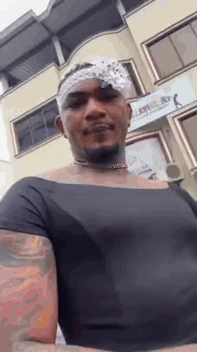 Man With Bandana In Black Shirt And Choker GIF