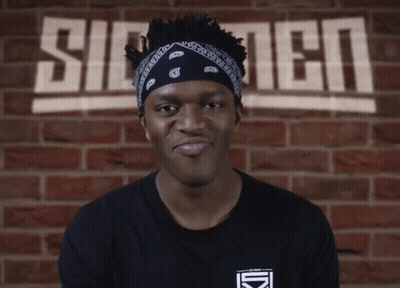 Man With Bandana In Front Of Silent Wall GIF
