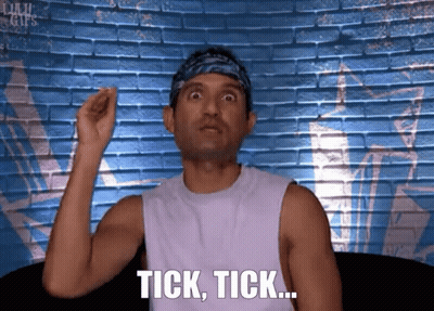 Man With Bandana Saying Tick Tick At Brick Wall GIF