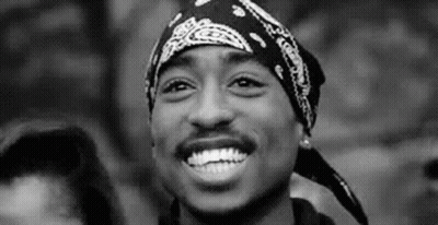 Man With Bandana Smiling In Black And White GIF