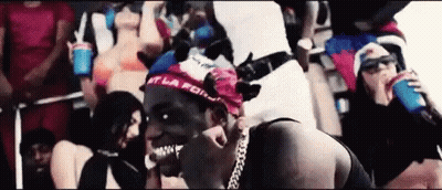 Man With Bandana Surrounded By Women GIF