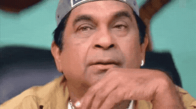 Man With Baseball Cap Hand On Chin GIF