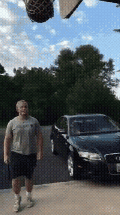 Man With Basketball In Front Of Car GIF